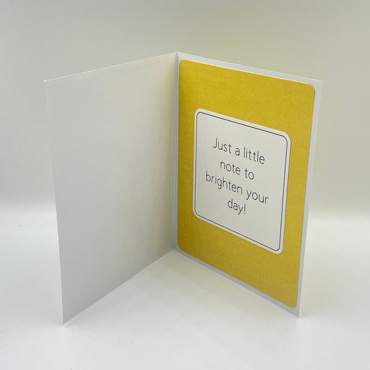 Open card with yellow background and Just a Little Note to brighten your day sentiment
