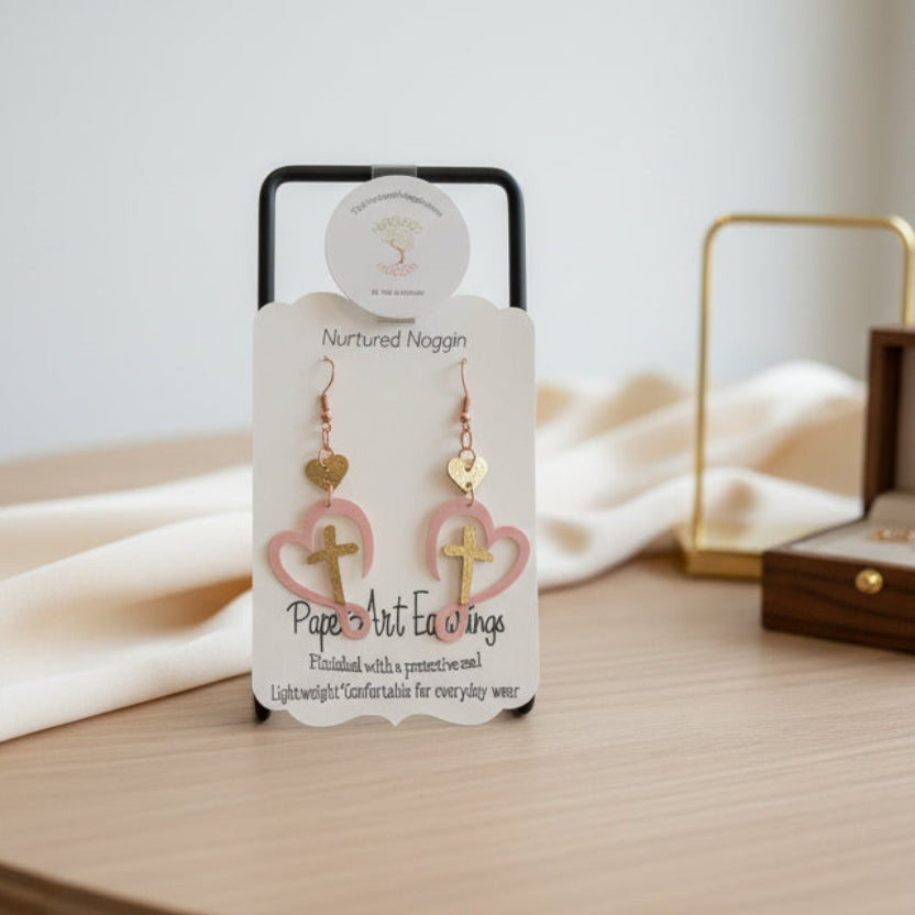 Pair of earrings on a branded card with a gray background