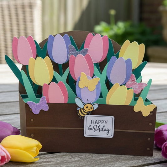 Card with tulips and butterflies on a wooden surface with flowers around