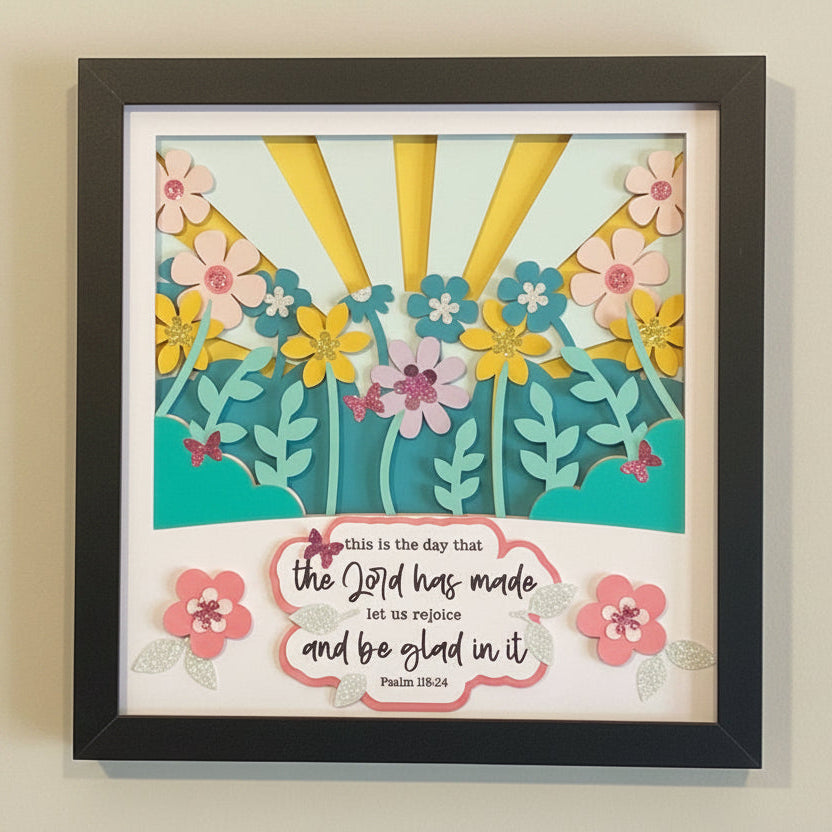 Decorative wall art with flowers and a biblical quote on a light background