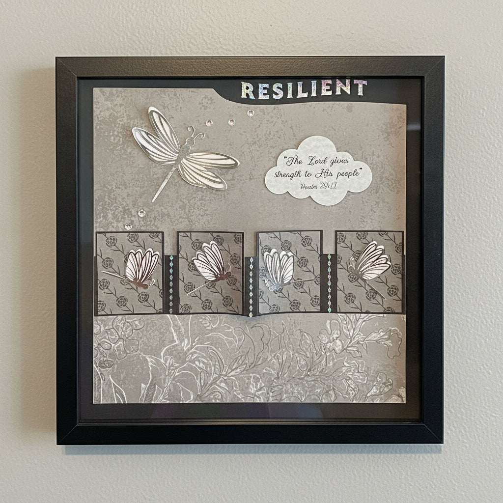 Decorative wall art with dragonflies  and motivational quote in a black frame.