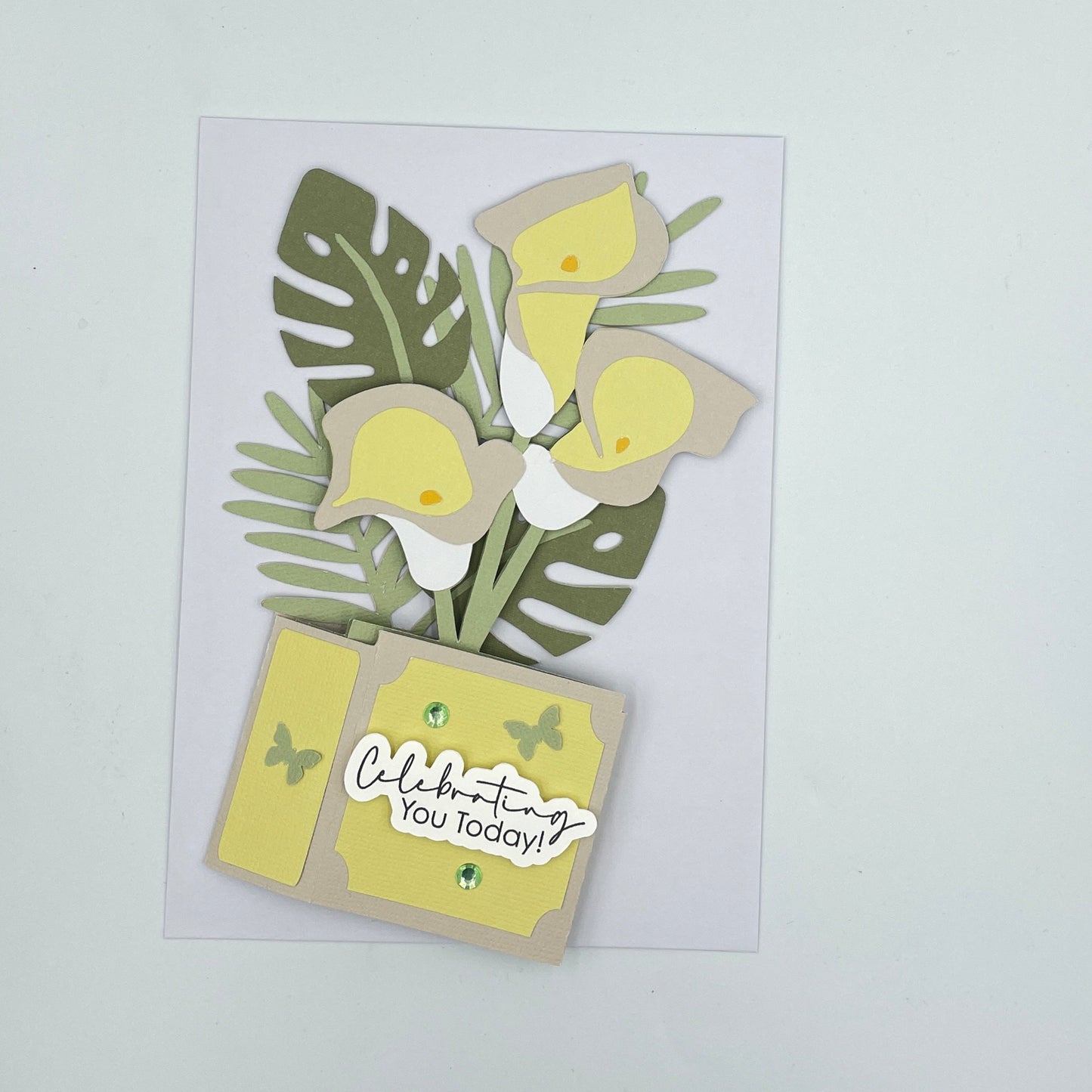 Lilies box card, flattened on a white envelope