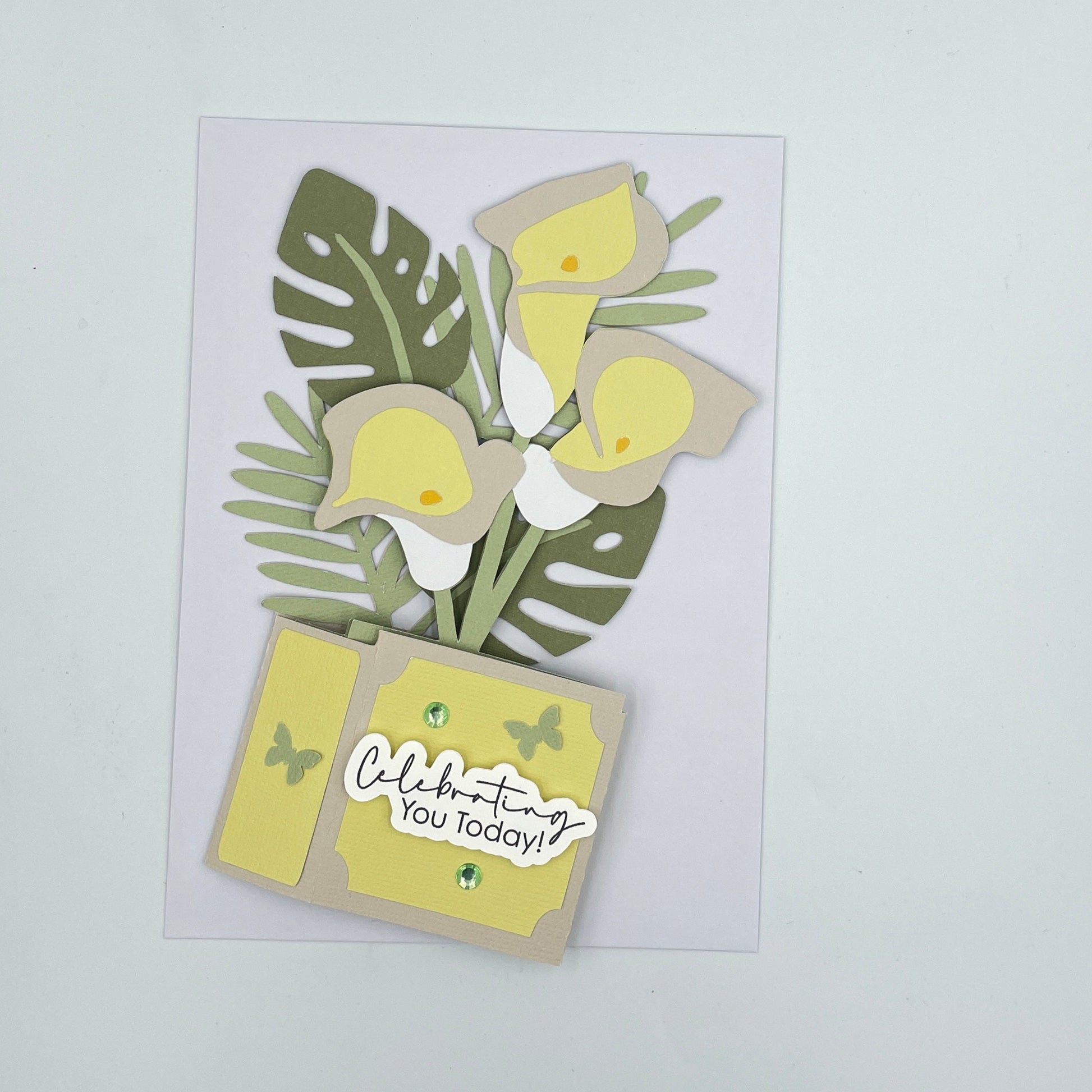 Lilies box card, flattened on a white envelope