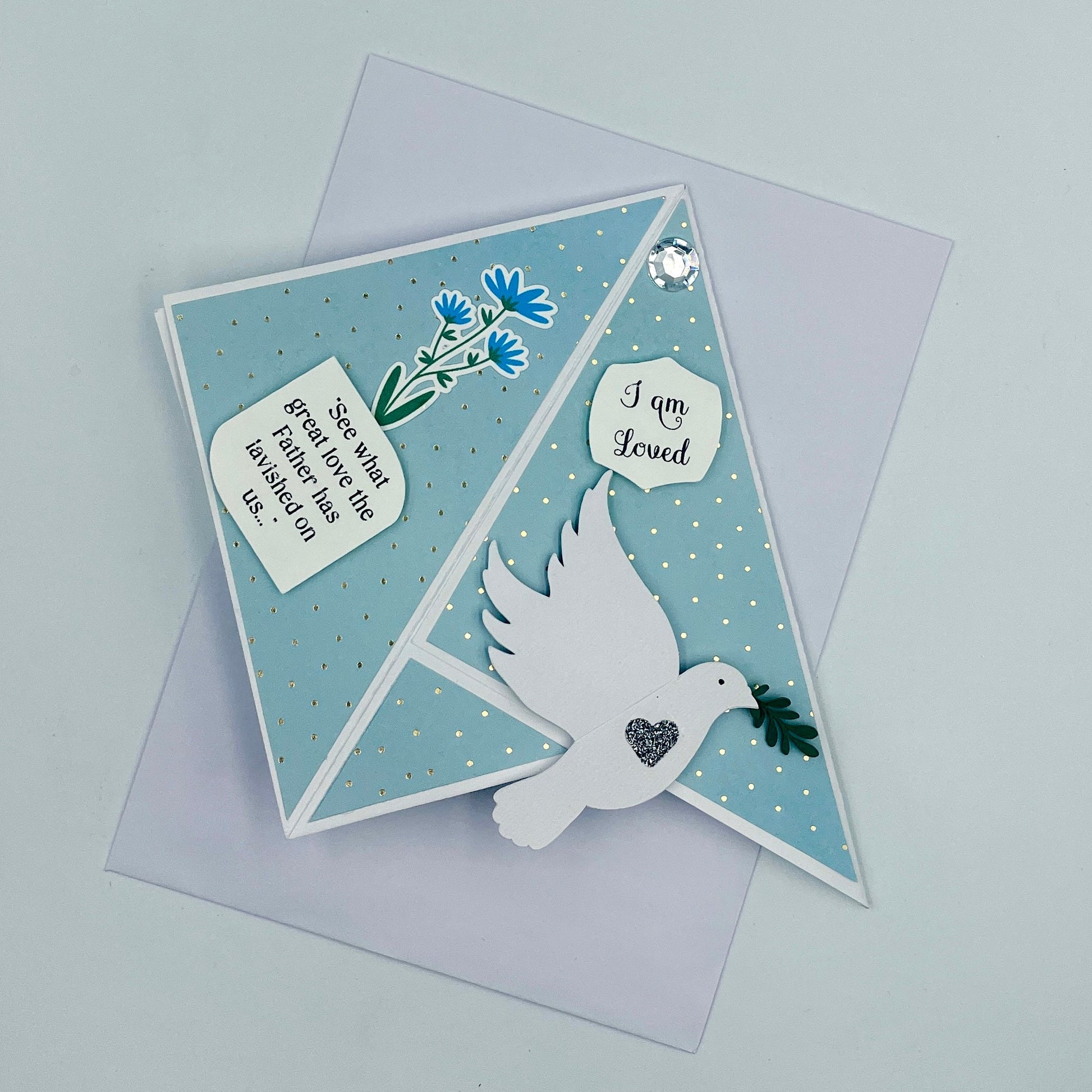 Greeting card with dove and floral design on a light gray background