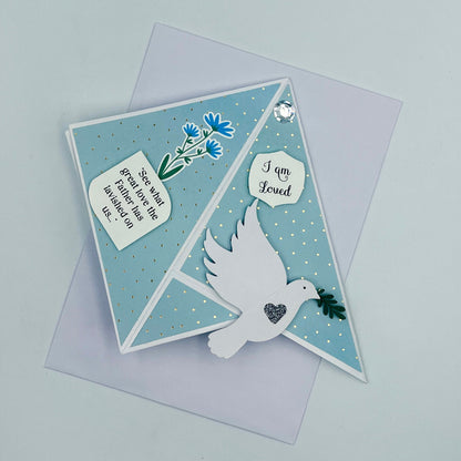 Greeting card with dove and floral design on a light gray background