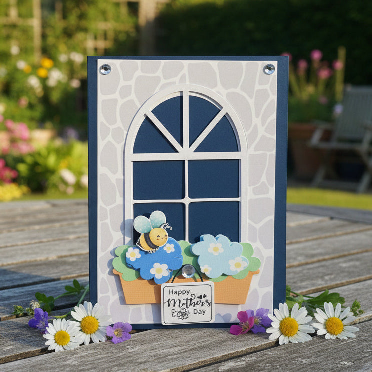 Greeting card with a window design, flowers, and a bee, featuring 'Happy Mother's Day' text.