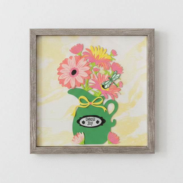 Shadowbox with a green pitcher holding pink flowers and a butterfly, with 'Choose Joy' text on a yellow background.