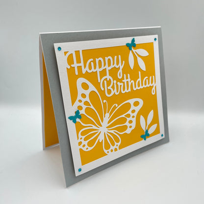 Birthday card with butterfly design and 'Happy Birthday' text on a yellow background