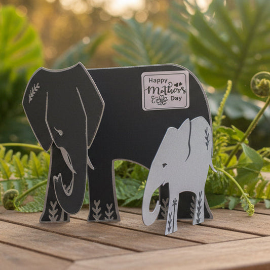 Blue elephant-shaped object with a 'Happy Mother's Day' sticker on a white background