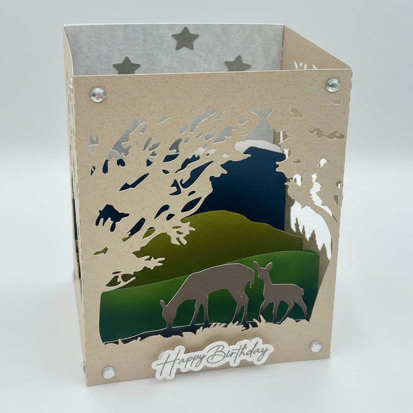 Laser-cut card with deer design and 'Happy Birthday' text on a white background