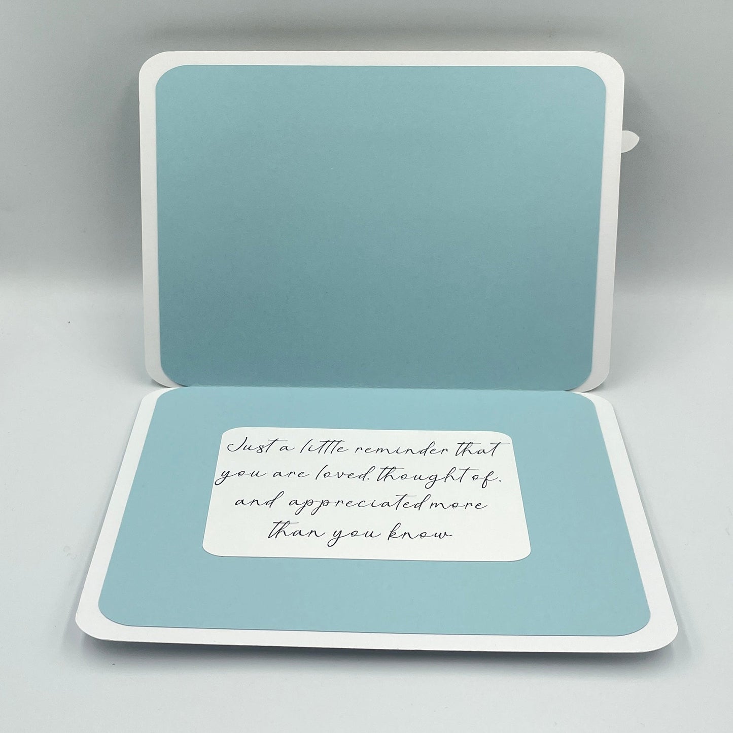 Open card with a message on a light gray background