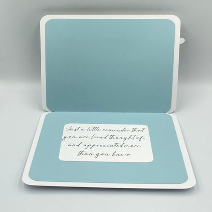 Open card with a message on a light gray background