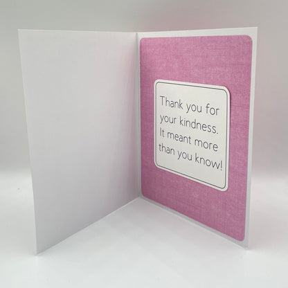 Open card with a white message on a pink background
