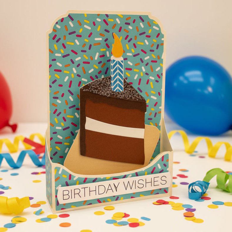 Birthday card with a cake illustration and 'Birthday Wishes' text on a gray background