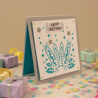 Birthday card with candles and 'Happy Birthday' text on a gray background