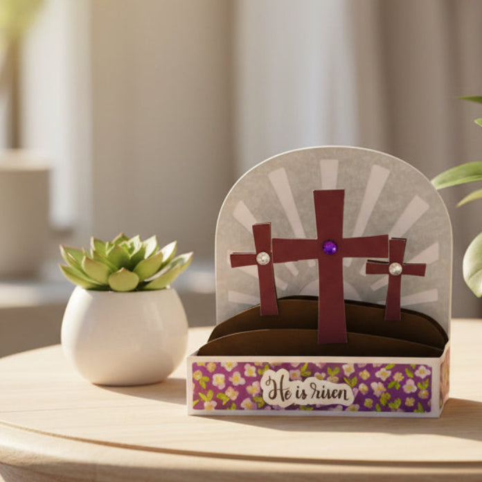 Easter-themed card with cross design and 'He is risen' text on a white background