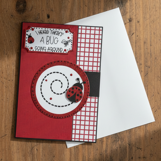Red greeting card with ladybug design and text on a white envelope 