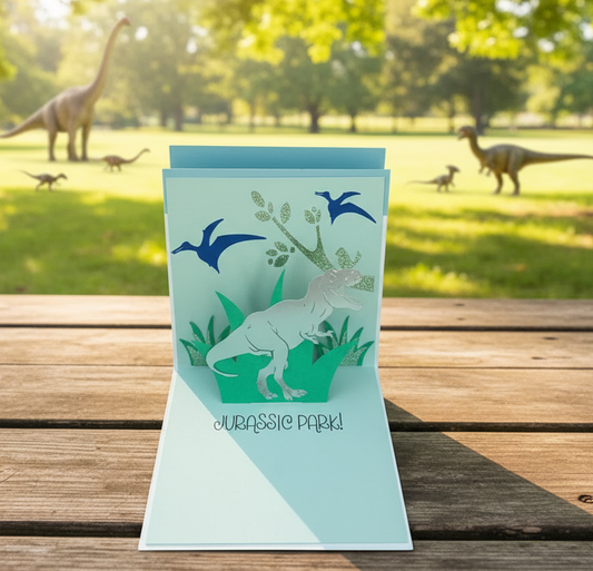 an open card featuring a pop up dinosaur in the middle